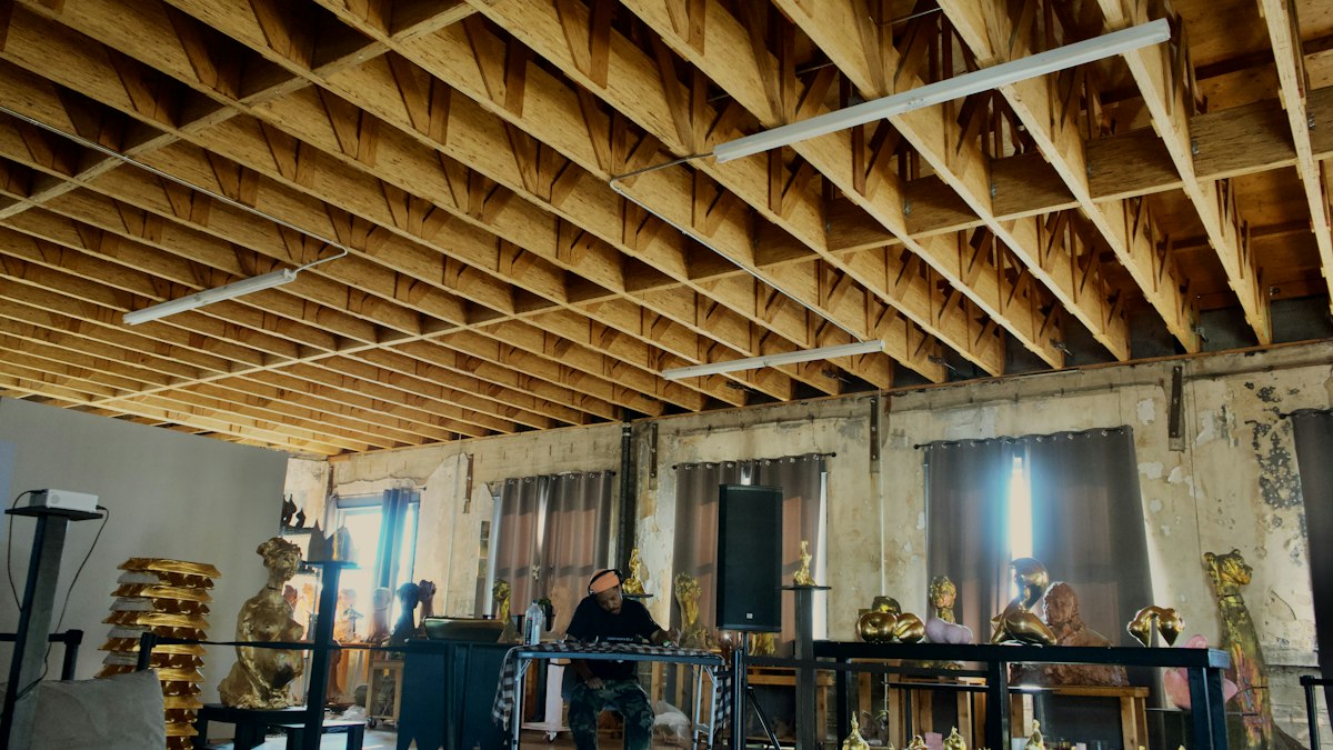 Artist studio beneath an exposed timber joist ceiling